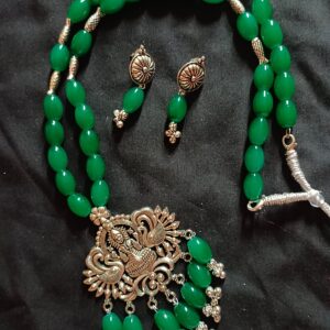 Green Glass bead necklace with oxidized Goddess pendant