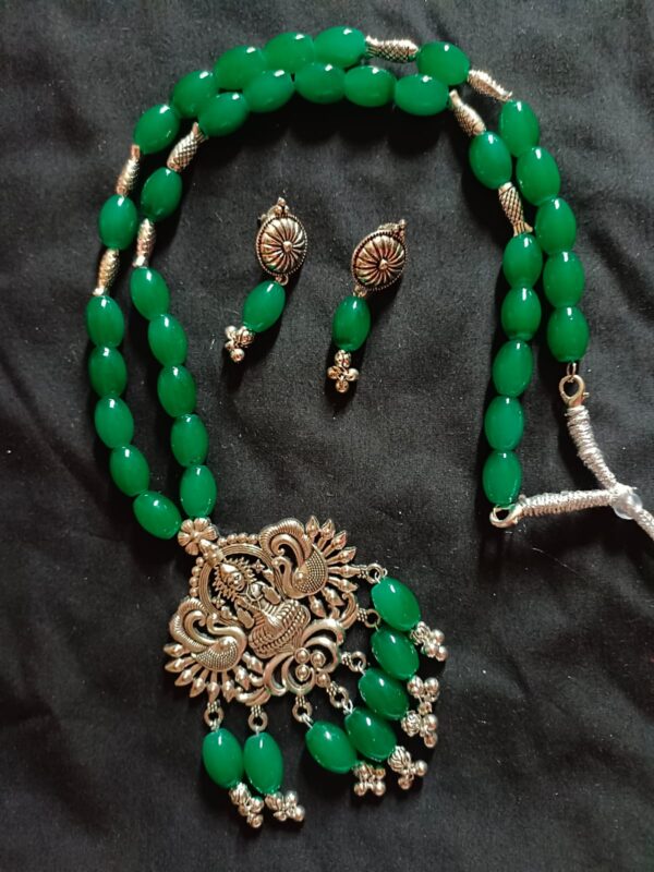Green Glass bead necklace with oxidized Goddess pendant