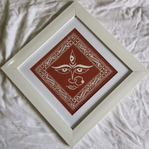 Devi Face on Geru Mitti Canvas with White Wooden Frame