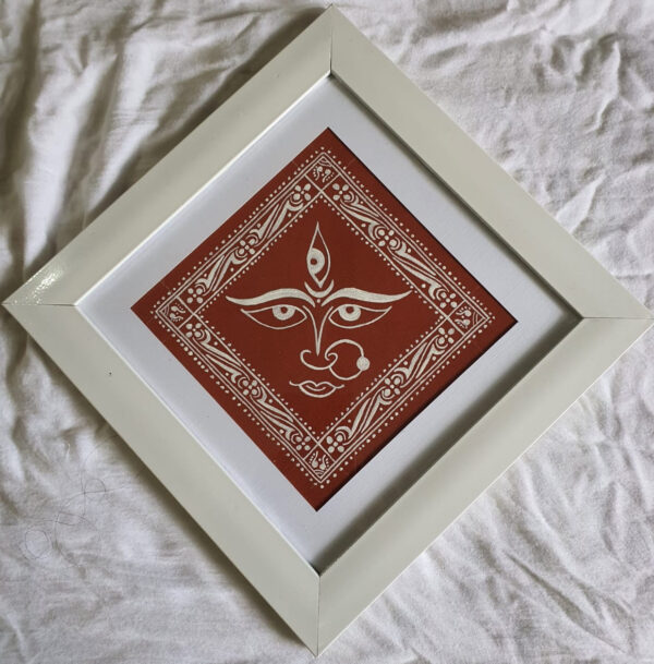 Devi Face on Geru Mitti Canvas with White Wooden Frame