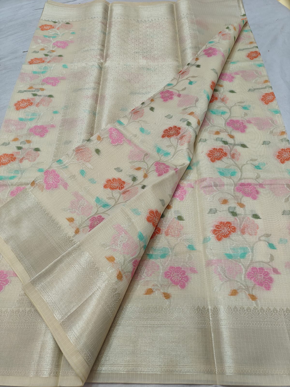Ivory Cream Handwoven Kota Doria Saree with Pastel Floral Weaving & Elegant Silver-Gold Zari Border | Premium Handloom Saree