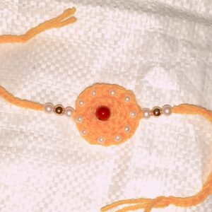 Handmade Peach Crochet Rakhi with Red Stone & Pearl Beads | Eco-Friendly Plant Fiber Raksha Bandhan Rakhi | Free Size